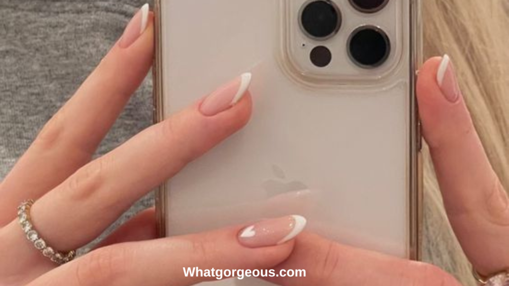 2. French Manicure with Heart on Ring Finger whatgorgeous.com