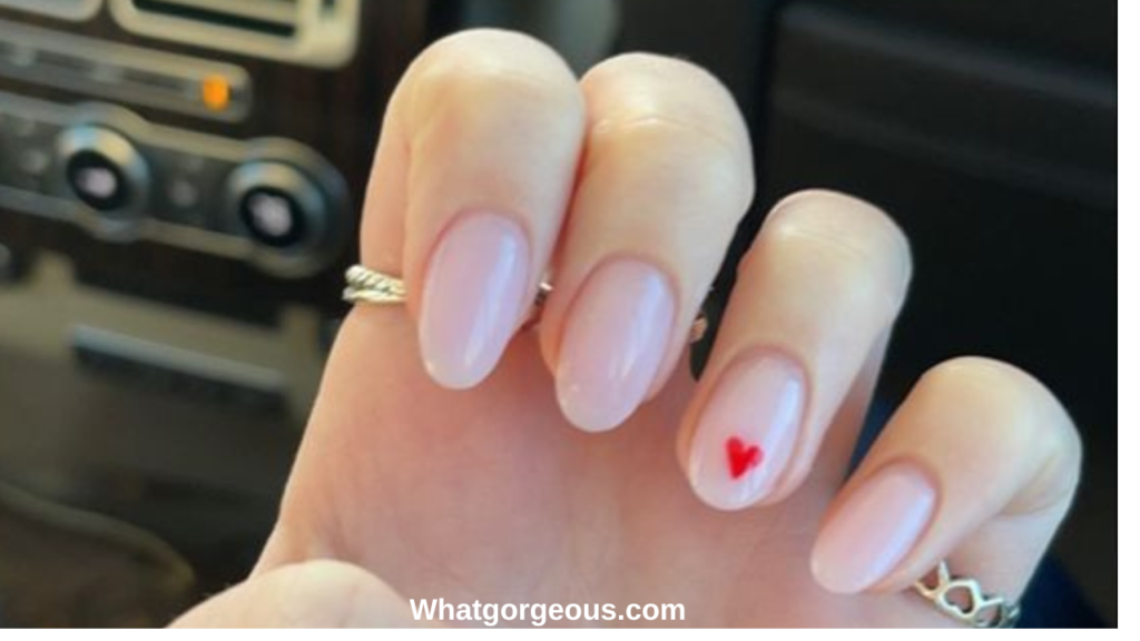 3. Pink Nails with White Heart on Ring Finger whatgorgeous.com